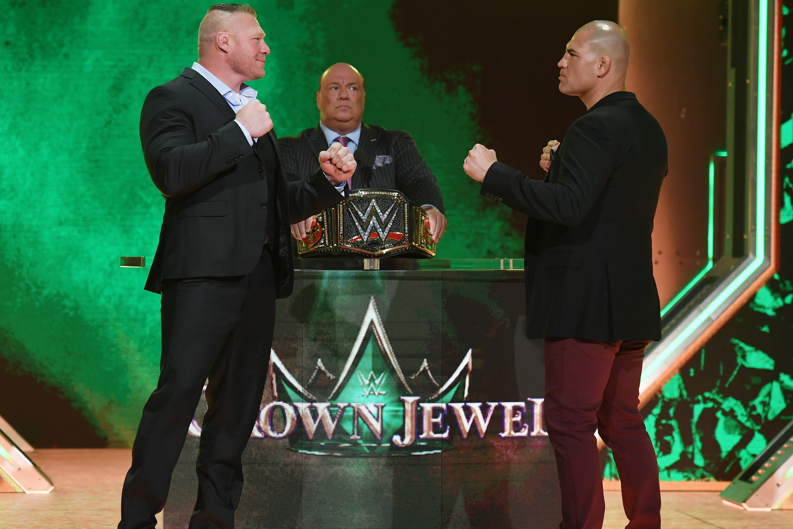 LAS VEGAS, NEVADA - OCTOBER 11: WWE champion Brock Lesnar (L) and former UFC heavyweight champion Cain Velasquez face off as Lesnar's advocate Paul Heyman (C) looks on during the announcement of their match at a WWE news conference at T-Mobile Arena on October 11, 2019 in Las Vegas, Nevada. Lesnar will face Velasquez and WWE wrestler Braun Strowman will take on heavyweight boxer Tyson Fury at the WWE's Crown Jewel event at Fahd International Stadium in Riyadh, Saudi Arabia on October 31. (Photo by Ethan Miller/Getty Images) LAS VEGAS, NEVADA - OCTOBER 11: WWE champion Brock Lesnar (L) and former UFC heavyweight champion Cain Velasquez face off as Lesnar's advocate Paul Heyman (C) looks on during the announcement of their match at a WWE news conference at T-Mobile Arena on October 11, 2019 in Las Vegas, Nevada. Lesnar will face Velasquez and WWE wrestler Braun Strowman will take on heavyweight boxer Tyson Fury at the WWE's Crown Jewel event at Fahd International Stadium in Riyadh, Saudi Arabia on October 31. (Photo by Ethan Miller/Getty Images)