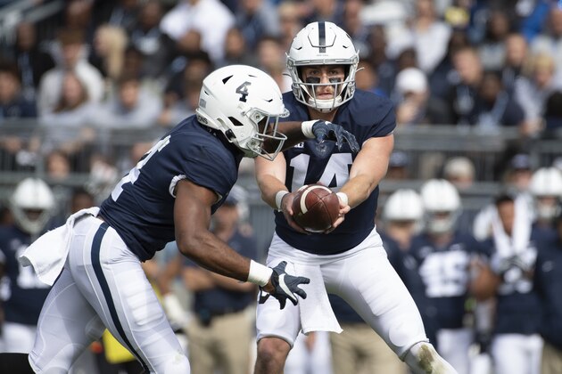 Penn State quarterback Sean Clifford (14) hands off to running back Journey Brown (4) in an NCAA college football game against Purdue in State College, Pa., on Saturday, Oct. 5, 2019. (AP Photo/Barry Reeger)