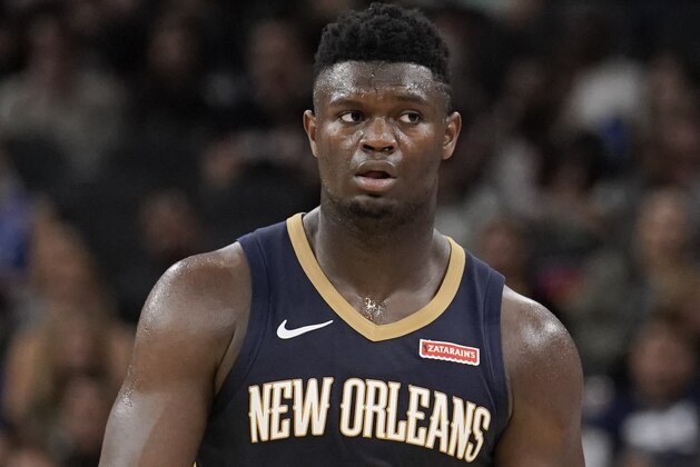 New Orleans Pelicans' Zion Williamson walks upcourt during the second half of an NBA preseason basketball game against the San Antonio Spurs, Sunday, Oct. 13, 2019, in San Antonio. (AP Photo/Darren Abate)