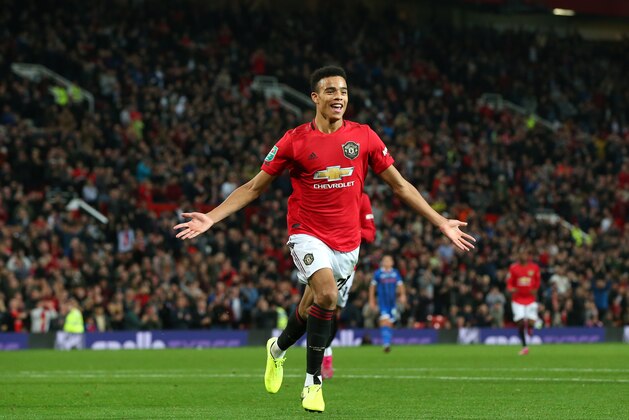 MANCHESTER, ENGLAND - SEPTEMBER 25: Mason Greenwood of Manchester United celebrates scoring his teams first goal of the game during the Carabao Cup Third Round match between Manchester United and Rochdale at Old Trafford on September 25, 2019 in Manchester, England. (Photo by Alex Livesey/Getty Images)