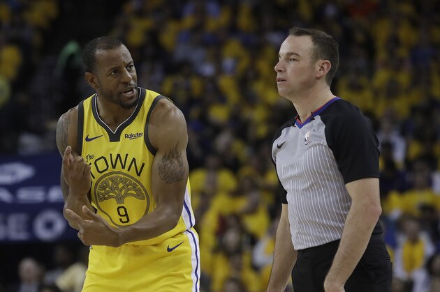 Golden State Warriors guard Andre Iguodala (9) gestures while talking to referee Josh Tiven (58) during the first half of Game 2 of a first-round NBA basketball playoff series against the Los Angeles Clippers in Oakland, Calif., Monday, April 15, 2019. (AP Photo/Jeff Chiu)