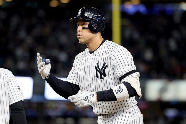 NEW YORK, NEW YORK - OCTOBER 18: Aaron Judge #99 of the New York Yankees celebrates after hitting a single against Justin Verlander #35 of the Houston Astros during the first inning in game five of the American League Championship Series at Yankee Stadium on October 18, 2019 in New York City. (Photo by Elsa/Getty Images)