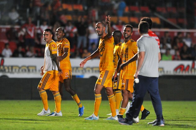Players of Tigres(L)  argue with players of Veracruz at the end of their Mexican Apertura tournament football match at Luis Pirata Fuente stadium in Veracruz, Veracruz state, Mexico on October 18, 2019. - Veracruz players did not engage on the game for the  first five minutes of the match to protest not receiving their salaries and received two goals. (Photo by VICTOR CRUZ / AFP) (Photo by VICTOR CRUZ/AFP via Getty Images)