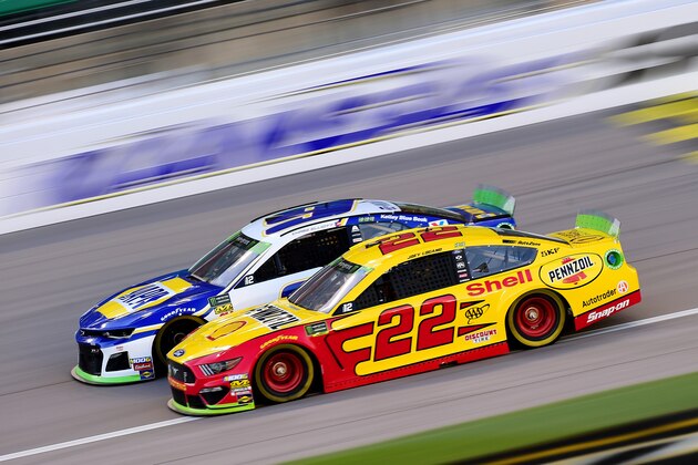 KANSAS CITY, KANSAS - OCTOBER 18: Joey Logano, driver of the #22 Shell Pennzoil Ford, drives next to Chase Elliott, driver of the #9 NAPA Auto Parts Chevrolet, during practice for the Monster Energy NASCAR Cup Series Hollywood Casino 400 at Kansas Speedway on October 18, 2019 in Kansas City, Kansas. (Photo by Jared C. Tilton/Getty Images)