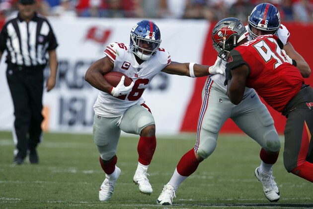 New York Giants running back Saquon Barkley (26) runs the ball against the Tampa Bay Buccaneers during an NFL football game, Sunday, Sept. 22, 2019, in Tampa, Fla. The Giants won the game 32-31. (Jeff Haynes/AP Images for Panini)