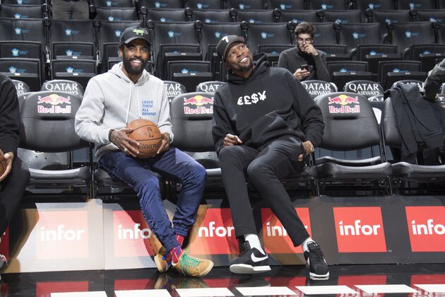 BROOKLYN, NY - OCTOBER 4: Kyrie Irving #11 of the Brooklyn Nets and Kevin Durant #7 of the Brooklyn Nets shares a laugh before the game on October 4, 2019 at Barclays Center in Brooklyn, New York. NOTE TO USER: User expressly acknowledges and agrees that, by downloading and or using this Photograph, user is consenting to the terms and conditions of the Getty Images License Agreement. Mandatory Copyright Notice: Copyright 2019 NBAE (Photo by Nathaniel S. Butler/NBAE via Getty Images)