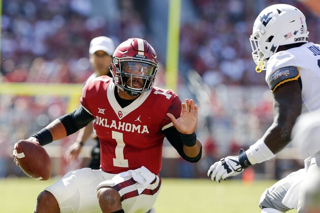 Oklahoma quarterback Jalen Hurts (1) runs against West Virginia during the first half of an NCAA college football game in Norman, Okla., Saturday, Oct. 19, 2019. (AP Photo/Alonzo Adams)