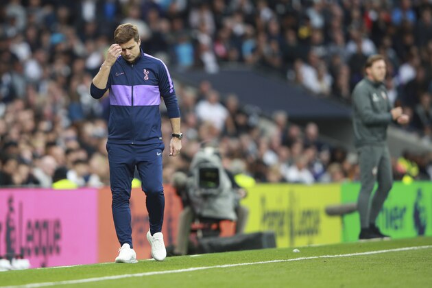Tottenham's manager Mauricio Pochettino, left, and Southampton's manager Ralph Hasenhuettl, right, watch their teams during the English Premier League soccer match between Tottenham Hotspur and Southampton at the White Heart Lane stadium in London, Saturday, Sept. 28, 2019. (AP Photo/Ian Walton)