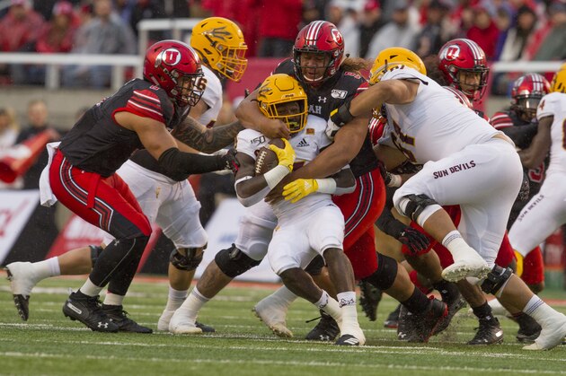 SALT LAKE CITY, UT - OCTOBER 19 : Eno Benjamin #3 of the Arizona State Sun Devils is tackled by Leki Fotu #99 and Bradlee Anae #6 of the Utah Utes during their game at Rice-Eccles Stadium on October 19, 2019 in Salt Lake City, Utah. (Photo by Chris Gardner/Getty Images)