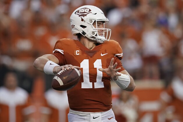 Texas's Sam Ehlinger (11) looks to pass against the Kansas during the first half of an NCAA college football game in Austin, Texas, Saturday, Oct. 19, 2019. (AP Photo/Chuck Burton)