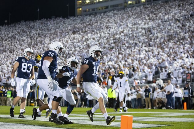 UNIVERSITY PARK, PA - OCTOBER 19:  Sean Clifford #14 of the Penn State Nittany Lions celebrates a touchdown run during the second quarter against the Michigan Wolverines on October 19, 2019 at Beaver Stadium in University Park, Pennsylvania.  (Photo by Brett Carlsen/Getty Images)