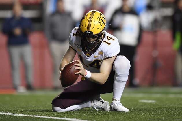 Minnesota Golden Gophers punter Casey O'Brien (14) holds the ball for an extra point kick during the second half of an NCAA college football game against Rutgers Saturday, Oct. 19, 2019, in Piscataway, N.J. (AP Photo/Sarah Stier)