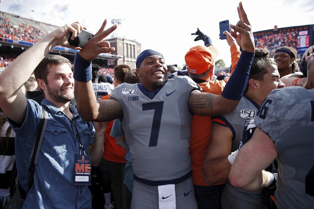 CHAMPAIGN, IL - OCTOBER 19: Stanley Green #7 of the Illinois Fighting Illini celebrates with fans after the game against the Wisconsin Badgers at Memorial Stadium on October 19, 2019 in Champaign, Illinois. Illinois defeated Wisconsin 24-23. (Photo by Joe Robbins/Getty Images)