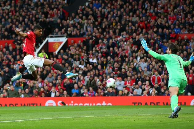 MANCHESTER, ENGLAND - OCTOBER 20: Marcus Rashford of Manchester United scores his sides first goal during the Premier League match between Manchester United and Liverpool FC at Old Trafford on October 20, 2019 in Manchester, United Kingdom. (Photo by Alex Livesey/Getty Images)