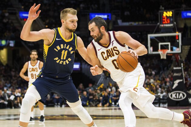 Cleveland Cavaliers' Kevin Love (0) dribbles around Indiana Pacers' Domantas Sabonis (11) during the second quarter of an NBA preseason basketball game, Friday, Oct. 6, 2017, in Cleveland. (AP Photo/Scott R. Galvin)