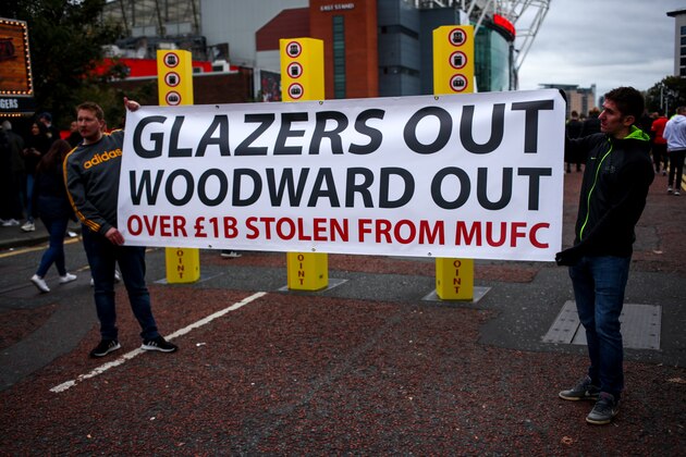 MANCHESTER, ENGLAND - OCTOBER 20: Fans of Manchester United protest against the owners of Manchester United, the Glazers and Chief Executive Ed Woodward prior to the Premier League match between Manchester United and Liverpool FC at Old Trafford on October 20, 2019 in Manchester, United Kingdom. (Photo by Robbie Jay Barratt - AMA/Getty Images)