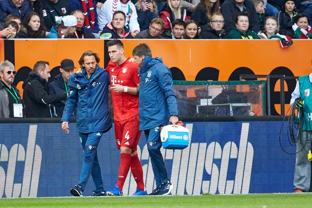AUGSBURG, GERMANY - OCTOBER 19: Niklas Suele of FC Bayern Muenchen injured during the Bundesliga match between FC Augsburg and FC Bayern Muenchen at WWK-Arena on October 19, 2019 in Augsburg, Germany. (Photo by TF-Images/Getty Images)
