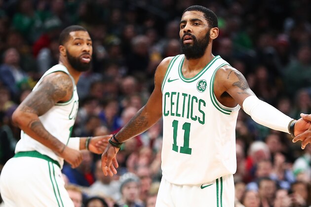 BOSTON, MA - JANUARY 21:  Kyrie Irving #11 high fives Marcus Morris #13 and Al Horford #42 of the Boston Celtics during a game against ethics's Miami Heat at TD Garden on January 21, 2019 in Boston, Massachusetts. NOTE TO USER: User expressly acknowledges and agrees that, by downloading and or using this photograph, User is consenting to the terms and conditions of the Getty Images License Agreement. (Photo by Adam Glanzman/Getty Images)