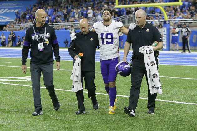 Minnesota Vikings wide receiver Adam Thielen (19) is helped off the field during the first half of an NFL football game against the Detroit Lions, Sunday, Oct. 20, 2019, in Detroit. (AP Photo/Duane Burleson)