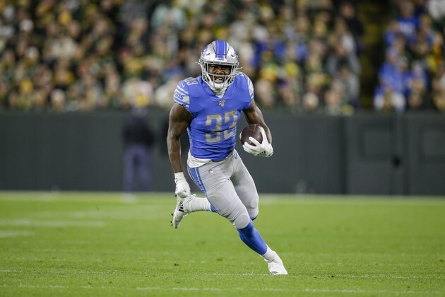 Detroit Lions running back Kerryon Johnson rushes during the first half of an NFL football game against the Green Bay Packers Monday, Oct. 14, 2019, in Green Bay, Wis. (AP Photo/Jeffrey Phelps)