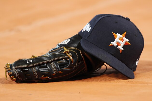 HOUSTON, TX - OCTOBER 19:  A Houston Astros hat and glove are seen on the field before Game Six of the League Championship Series against the New York Yankees at Minute Maid Park on October 19, 2019 in Houston, Texas.  (Photo by Tim Warner/Getty Images)