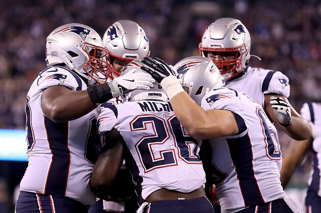 EAST RUTHERFORD, NEW JERSEY - OCTOBER 21: Sony Michel #26 of the New England Patriots and teammates celebrate his touchdown against the New York Jets in the first quarter of their game at MetLife Stadium on October 21, 2019 in East Rutherford, New Jersey. (Photo by Al Bello/Getty Images)
