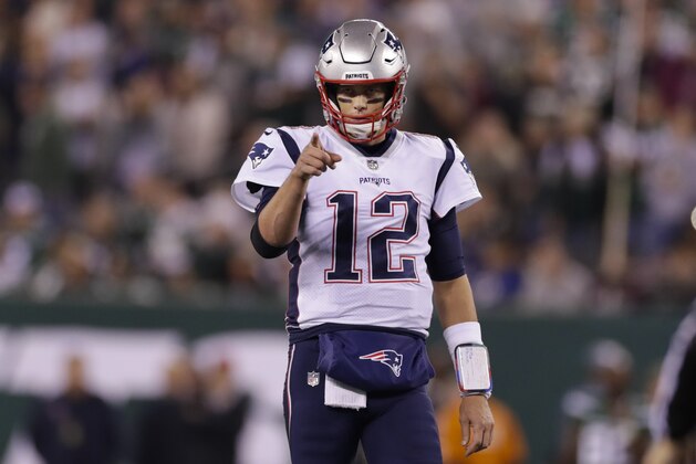 New England Patriots quarterback Tom Brady (12) points to Benjamin Watson (84) after a play during the first half of an NFL football game against the New York Jets, Monday, Oct. 21, 2019, in East Rutherford, N.J. (AP Photo/Adam Hunger)