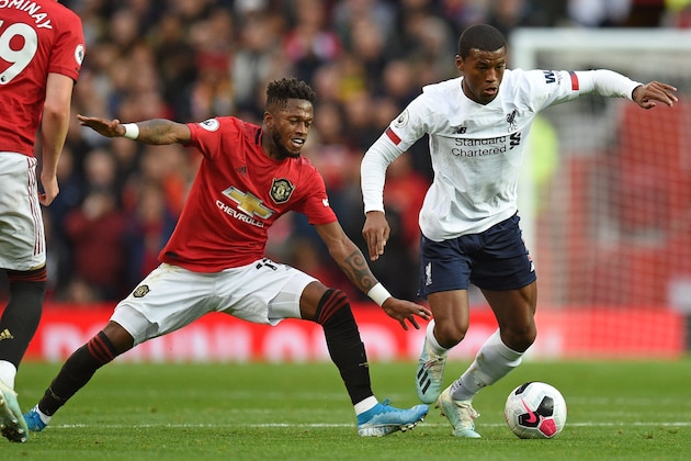 TOPSHOT - Manchester United's Brazilian midfielder Fred (L) vies with Liverpool's Dutch midfielder Georginio Wijnaldum (R) during the English Premier League football match between Manchester United and Liverpool at Old Trafford in Manchester, north west England, on October 20, 2019. (Photo by Oli SCARFF / AFP) / RESTRICTED TO EDITORIAL USE. No use with unauthorized audio, video, data, fixture lists, club/league logos or 'live' services. Online in-match use limited to 120 images. An additional 40 images may be used in extra time. No video emulation. Social media in-match use limited to 120 images. An additional 40 images may be used in extra time. No use in betting publications, games or single club/league/player publications. /  (Photo by OLI SCARFF/AFP via Getty Images)