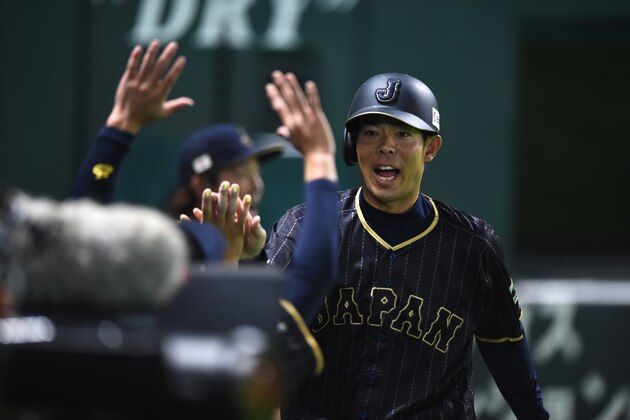 FUKUOKA, JAPAN - MARCH 01:  Outfielder Shogo Akiyama #55 of Japan celebrates with team mates after scoring a run after a grounder by Yoshitomo Tsutsugoh #25 in the top of the fifth inning during the SAMURAI JAPAN Send-off Friendly Match between CPBL Selected Team and Japan at the Yafuoku Dome on March 1, 2017 in Fukuoka, Japan.  (Photo by Matt Roberts/Getty Images)