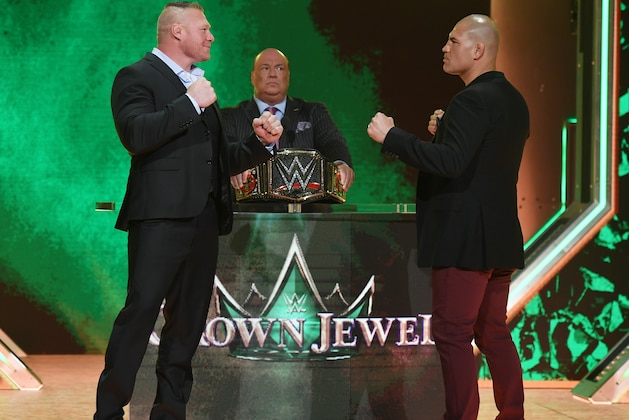 LAS VEGAS, NEVADA - OCTOBER 11:  WWE champion Brock Lesnar (L) and former UFC heavyweight champion Cain Velasquez face off as Lesnar's advocate Paul Heyman (C) looks on during the announcement of their match at a WWE news conference at T-Mobile Arena on October 11, 2019 in Las Vegas, Nevada. Lesnar will face Velasquez and WWE wrestler Braun Strowman will take on heavyweight boxer Tyson Fury at the WWE's Crown Jewel event at Fahd International Stadium in Riyadh, Saudi Arabia on October 31.  (Photo by Ethan Miller/Getty Images)
