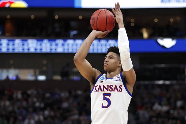Kansas guard Quentin Grimes (5) shoots against Northeastern during a first round men's college basketball game in the NCAA Tournament Thursday, March 21, 2019, in Salt Lake City. (AP Photo/Jeff Swinger)