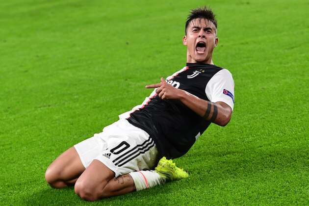 Juventus' Argentine forward Paulo Dybala celebrates after scoring his second goal during the UEFA Champions League Group D football match Juventus vs Lokomotiv Moscow on October 22, 2019 at the Juventus stadium in Turin. (Photo by Miguel MEDINA / AFP) (Photo by MIGUEL MEDINA/AFP via Getty Images)
