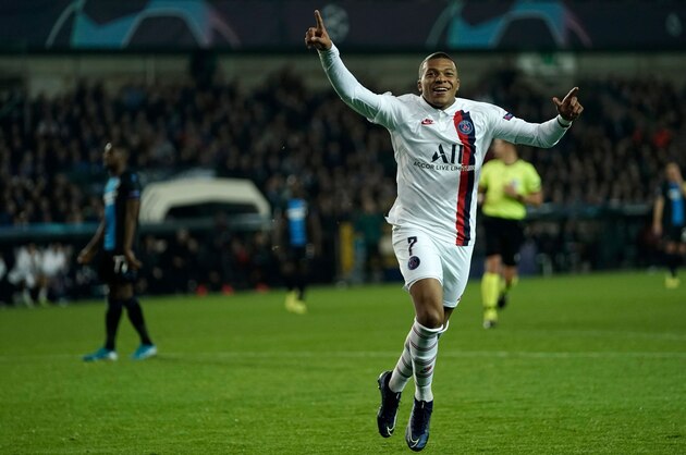 Paris Saint-Germain's French forward Kylian Mbappe celebrates scoring his team's fifth goal during the UEFA Champions League Group A football match between Brugge and Paris Saint-Germain's (PSG)  on October 22, 2019 at the Jan Breydel stadium in Bruges. (Photo by Kenzo TRIBOUILLARD / AFP) (Photo by KENZO TRIBOUILLARD/AFP via Getty Images)