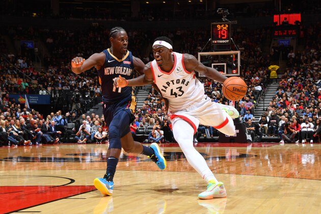 TORONTO, CANADA - OCTOBER 22: Pascal Siakam #43 of the Toronto Raptors handles the ball against Jrue Holiday #11 of the New Orleans Pelicans on October 22, 2019 at the Scotiabank Arena in Toronto, Ontario, Canada. NOTE TO USER: User expressly acknowledges and agrees that, by downloading and or using this Photograph, user is consenting to the terms and conditions of the Getty Images License Agreement.  Mandatory Copyright Notice: Copyright 2019 NBAE (Photo by Jesse D. Garrabrant/NBAE via Getty Images)