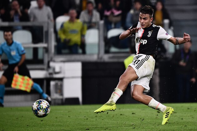 Juventus' Argentine forward Paulo Dybala shoots to score his second goal during the UEFA Champions League Group D football match Juventus vs Lokomotiv Moscow on October 22, 2019 at the Juventus stadium in Turin. (Photo by Marco Bertorello / AFP) (Photo by MARCO BERTORELLO/AFP via Getty Images)