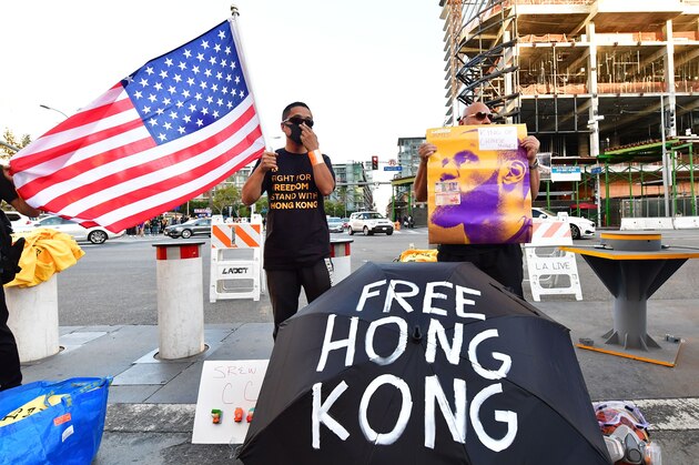Hong Kong supporters protest outside Staples Center ahead of the Lakers vs Clippers NBA season opener in Los Angeles on October 22, 2019. - Activists handed out free T-shirts displaying support for the Hong Kong protests after an NBA fan in Northern California raised enough money to pay for more than 10,000 shirts, according to the organizer who goes by the pseudonym