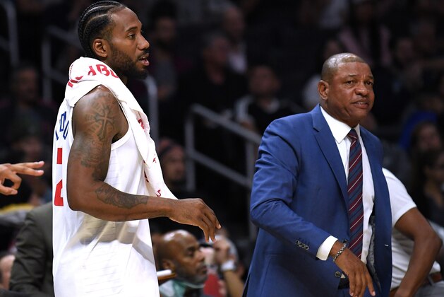 LOS ANGELES, CALIFORNIA - OCTOBER 10:  Kawhi Leonard #2 and Doc Rivers of the LA Clippers during a 111-91 Denver Nuggets preseason win at Staples Center on October 10, 2019 in Los Angeles, California. (Photo by Harry How/Getty Images)