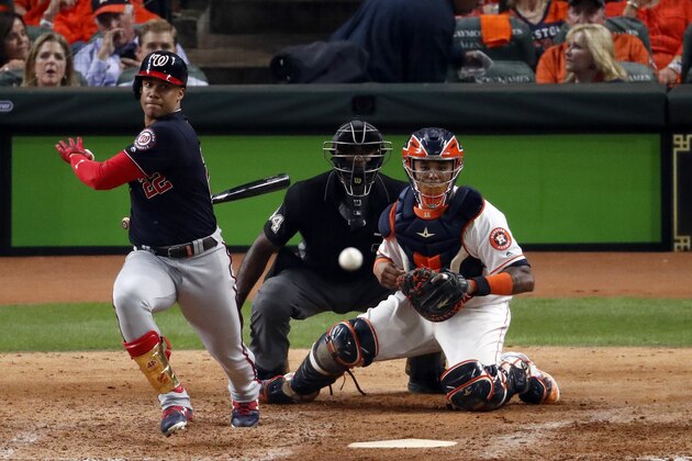 HOUSTON, TEXAS - OCTOBER 22:  Juan Soto #22 of the Washington Nationals singles against the Houston Astros during the eighth inning in Game One of the 2019 World Series at Minute Maid Park on October 22, 2019 in Houston, Texas. (Photo by Tim Warner/Getty Images)