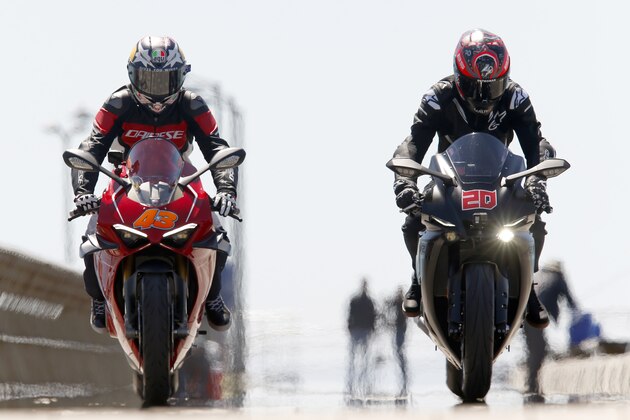 MELBOURNE, AUSTRALIA - OCTOBER 23:Jack Miller and Fabio Quartararo ride on the Lorne Pier in Victoria ahead of the 2019 Australian MotoGP on October 23, 2019 in Melbourne, Australia. (Photo by Darrian Traynor/Getty Images for AGPC)