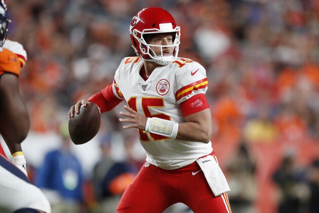 Kansas City Chiefs quarterback Patrick Mahomes (15) throws against the Denver Broncos during the first half of an NFL football game, Thursday, Oct. 17, 2019, in Denver. (AP Photo/David Zalubowski)