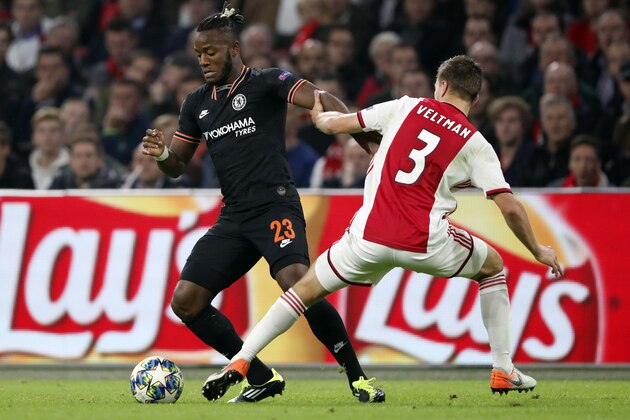 (l-r) Michy Batshuayi of Chelsea FC , Joel Veltman of Ajax during the UEFA Champions League group H match between Ajax Amsterdam and Chelsea FC at the Johan Cruijff Arena on October 23, 2019 in Amsterdam, The Netherlands(Photo by ANP Sport via Getty Images)