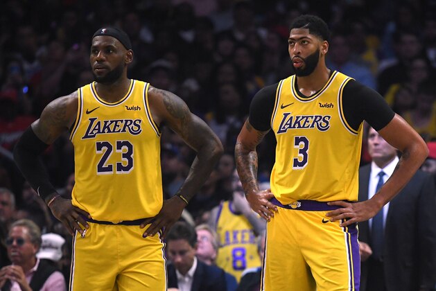 LOS ANGELES, CALIFORNIA - OCTOBER 22:   LeBron James #23 and Anthony Davis #3 of the Los Angeles Lakers react as they trail the LA Clippers during the fourth quarter in a 112-102 Clippers win during the LA Clippers season home opener at Staples Center on October 22, 2019 in Los Angeles, California. (Photo by Harry How/Getty Images)