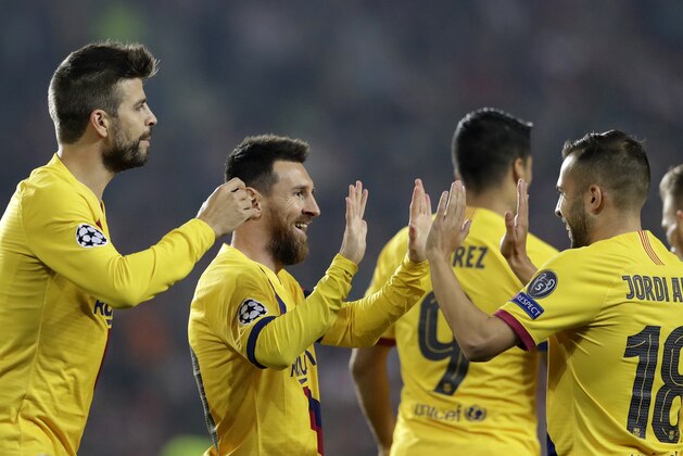 Barcelona's Lionel Messi, second left, celebrates with teammates after scoring his side's opening goal during the Champions League group F soccer match between Slavia Praha and FC Barcelona at the Sinobo stadium in Prague, Czech Republic, Wednesday, Oct. 23, 2019. (AP Photo/Petr David Josek)