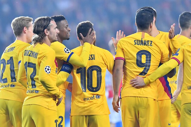 Barcelona's players celebrate after Barcelona's Argentine forward Lionel Messi (C) scored the 0-1 during the UEFA Champions League football match between SK Slavia Prague and FC Barcelona in Prague, Czech Republic on October 23, 2019. (Photo by JOE KLAMAR / AFP) (Photo by JOE KLAMAR/AFP via Getty Images)