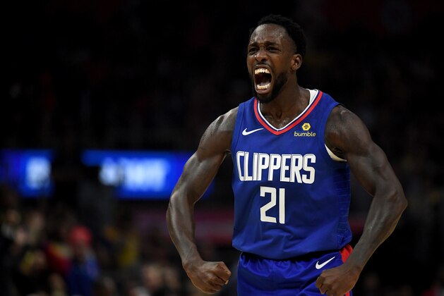 LOS ANGELES, CALIFORNIA - OCTOBER 22:  Patrick Beverley #21 of the LA Clippers reacts to a Montrezl Harrell #5 basket and foul in a 112-102 win over the Los Angeles Lakers during the LA Clippers season home opener at Staples Center on October 22, 2019 in Los Angeles, California. (Photo by Harry How/Getty Images)