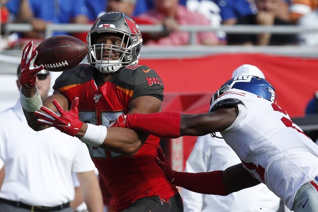 Tampa Bay Buccaneers tight end O.J. Howard (80) reaches for a pass as New York Giants free safety Jabrill Peppers (21) defends during an NFL football game, Sunday, Sept. 22, 2019, in Tampa, Fla. The Giants won the game 32-31. (Jeff Haynes/AP Images for Panini)