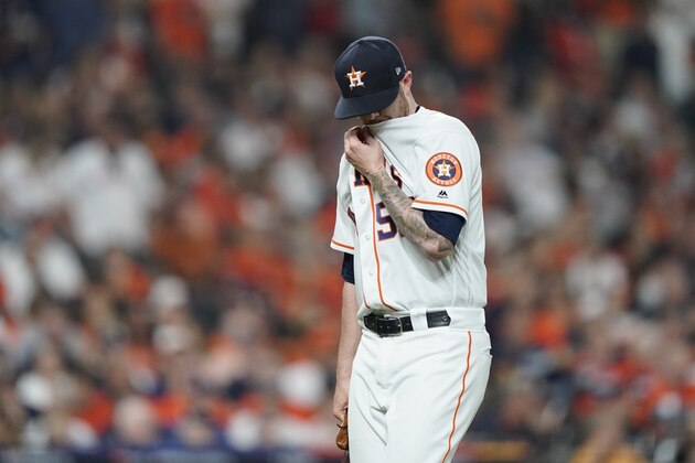 Houston Astros relief pitcher Ryan Pressly reacts after being relieved during the seventh inning of Game 2 of the baseball World Series against the Washington Nationals Wednesday, Oct. 23, 2019, in Houston. (AP Photo/David J. Phillip)