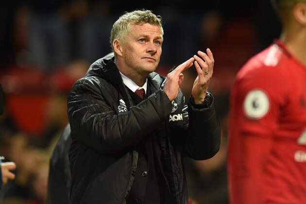 Manchester United's Norwegian manager Ole Gunnar Solskjaer applauds as he leaves after the English Premier League football match between Manchester United and Liverpool at Old Trafford in Manchester, north west England, on October 20, 2019. - The game finished 1-1. (Photo by Oli SCARFF / AFP) / RESTRICTED TO EDITORIAL USE. No use with unauthorized audio, video, data, fixture lists, club/league logos or 'live' services. Online in-match use limited to 120 images. An additional 40 images may be used in extra time. No video emulation. Social media in-match use limited to 120 images. An additional 40 images may be used in extra time. No use in betting publications, games or single club/league/player publications. /  (Photo by OLI SCARFF/AFP via Getty Images)