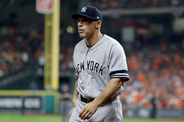 HOUSTON, TX - OCTOBER 21:  Joe Girardi #28 of the New York Yankees walks back to the dugout against the Houston Astros during the second inning in Game Seven of the American League Championship Series at Minute Maid Park on October 21, 2017 in Houston, Texas.  (Photo by Elsa/Getty Images)