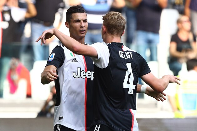 TURIN, ITALY - SEPTEMBER 28:  Cristiano Ronaldo (L) of Juventus FC celebrates his goal with his team-mate Matthijs de Ligt (R) during the Serie A match between Juventus and SPAL at Allianz Stadium on September 29, 2019 in Turin, Italy.  (Photo by Marco Luzzani/Getty Images)